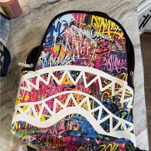 Sprayground Black Backpack with Red Limited Edition Patch